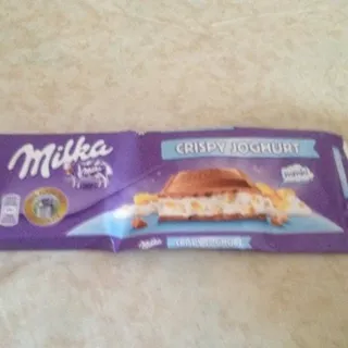 Milka milk chocolate with yogurt filling, rice puffs, and corn flakes 300g — photo 5