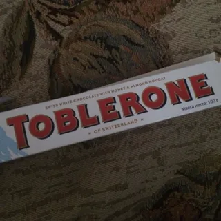 Toblerone White Chocolate with Honey Almond Nougat Box 100g — photo 10
