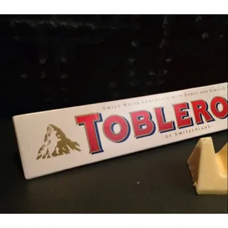 Toblerone White Chocolate with Honey Almond Nougat Box 100g — photo 9
