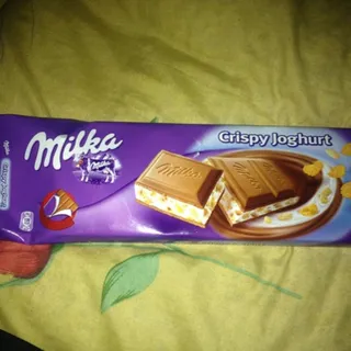 Milka milk chocolate with yogurt filling, rice puffs, and corn flakes 300g — photo 4