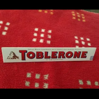 Toblerone White Chocolate with Honey Almond Nougat Box 100g — photo 8