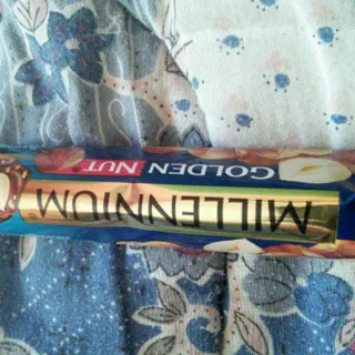 Millennium Golden Nut milk chocolate with whole hazelnuts 40g — photo 2
