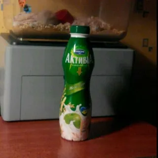 Bifidoyogurt Danone Activia Apple Grains 1.5% plastic bottle 580g — photo 2
